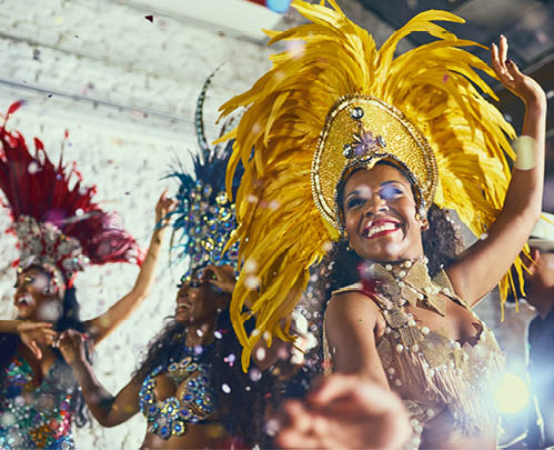 Carnival, performance and woman with samba for dance, parade and event in Brazil. Happiness, female dancer and celebration in city with creative fashion, confetti and music for tradition and culture.