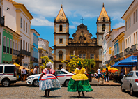 Bright view of Pelourinho in Salvador, Brazil, dominated by the large colonial Cruzeiro de Sao Francisco Christian stone cross in the Pra a Anchieta, America