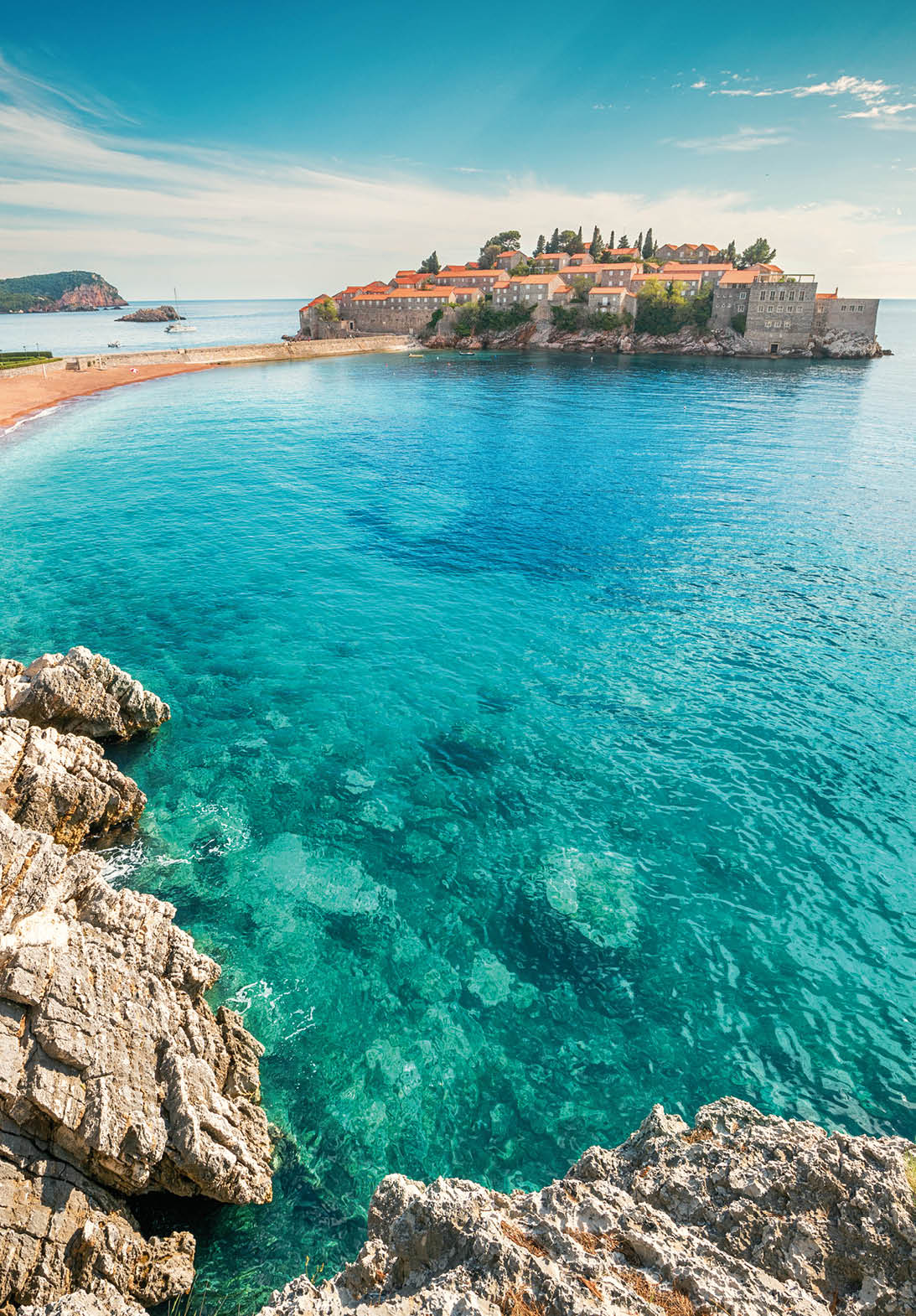 Discover the luxury of Montenegro's Sveti Stefan island, with its turquoise waters and scenic coastline against a backdrop of Balkan charm.