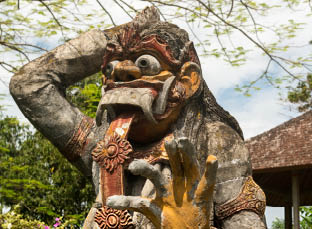 Closeup of traditional Balinese God statue in Central Bali temple