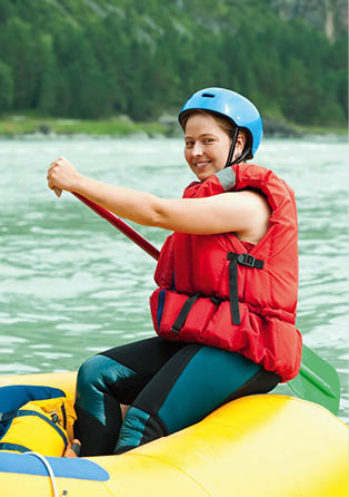 Girl with a paddle on the raft