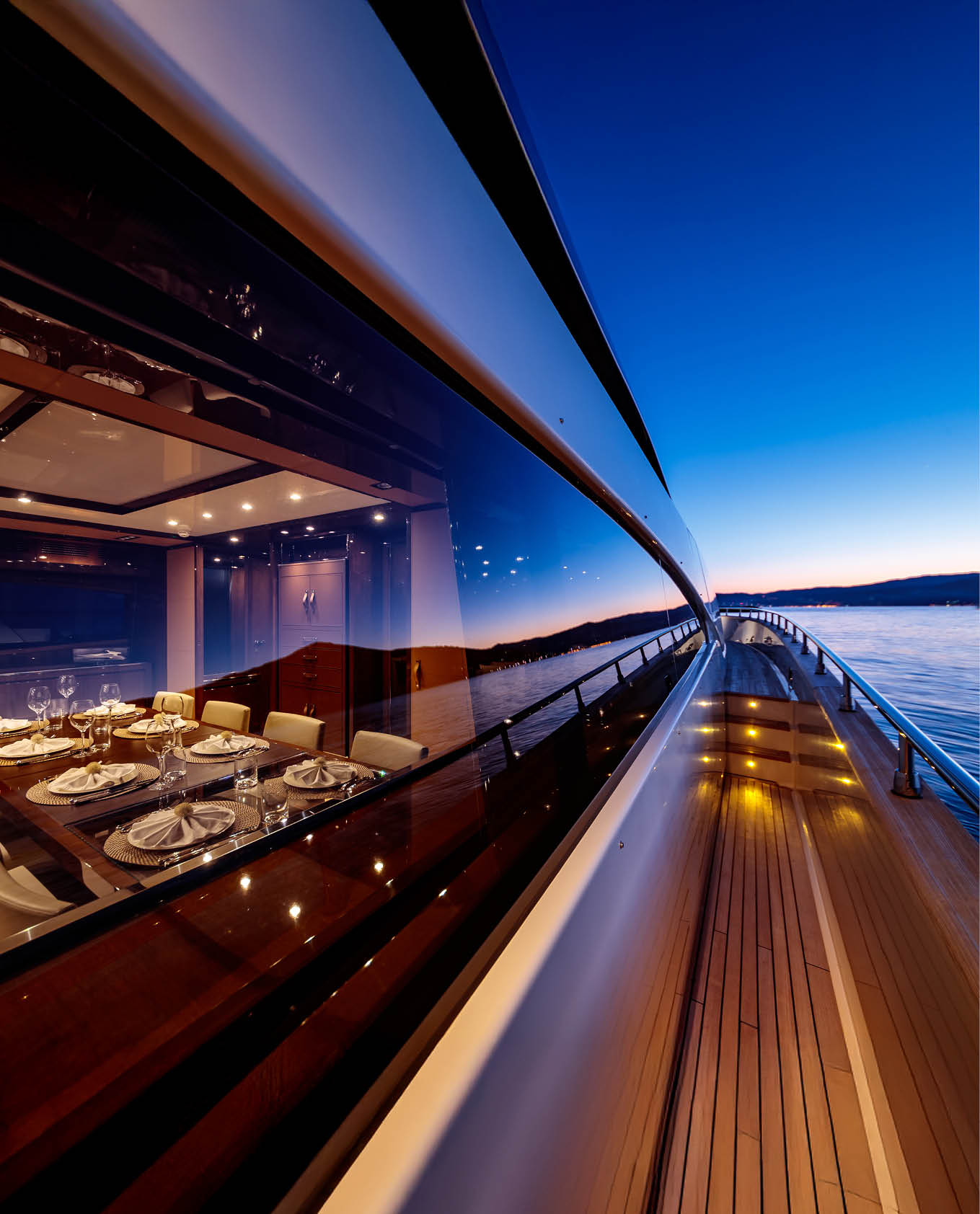 A beautiful shot from the yacht under a dark blue sky at night time