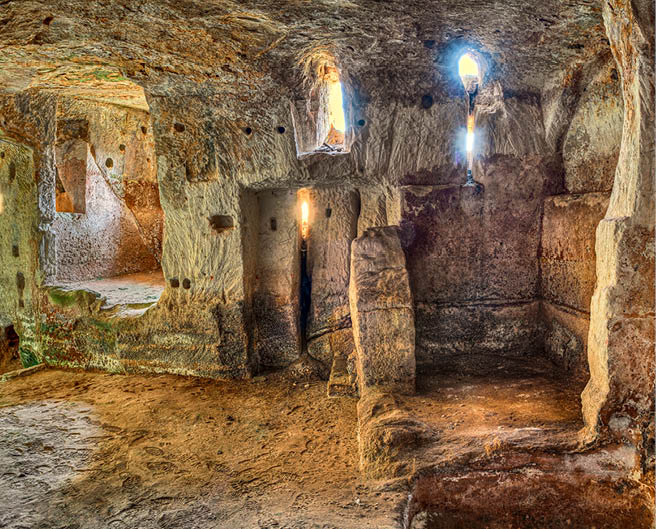 Matera, Basilicata, Italy: interior of an old cave house carved into the tufa rock in the old town (sassi di Matera) 