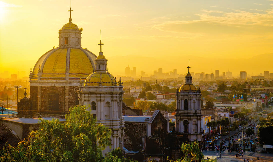 Scenic view at Basilica of Guadalupe with Mexico city skyline at sunset, Mexico