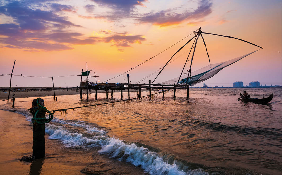 Kochi Chinese fishnets on sunset in Fort Kochin, Kochi, Kerala, India