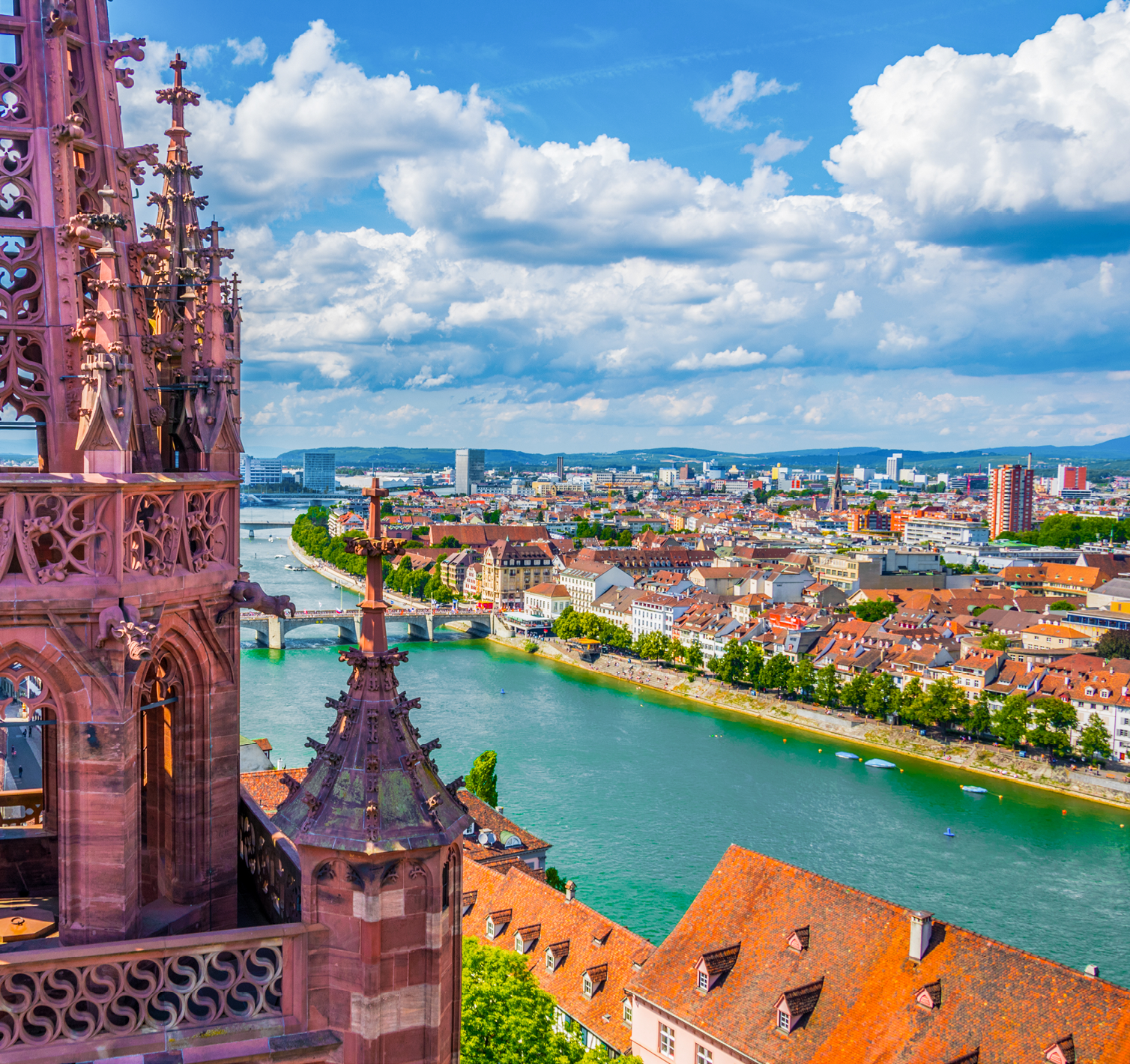 Riverside of Rhine in Basel dominated by majestic building of Munster church, Switzerland 