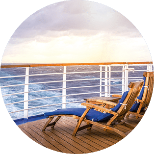 Cruise ship wooden deck chairson the main deck at sunset