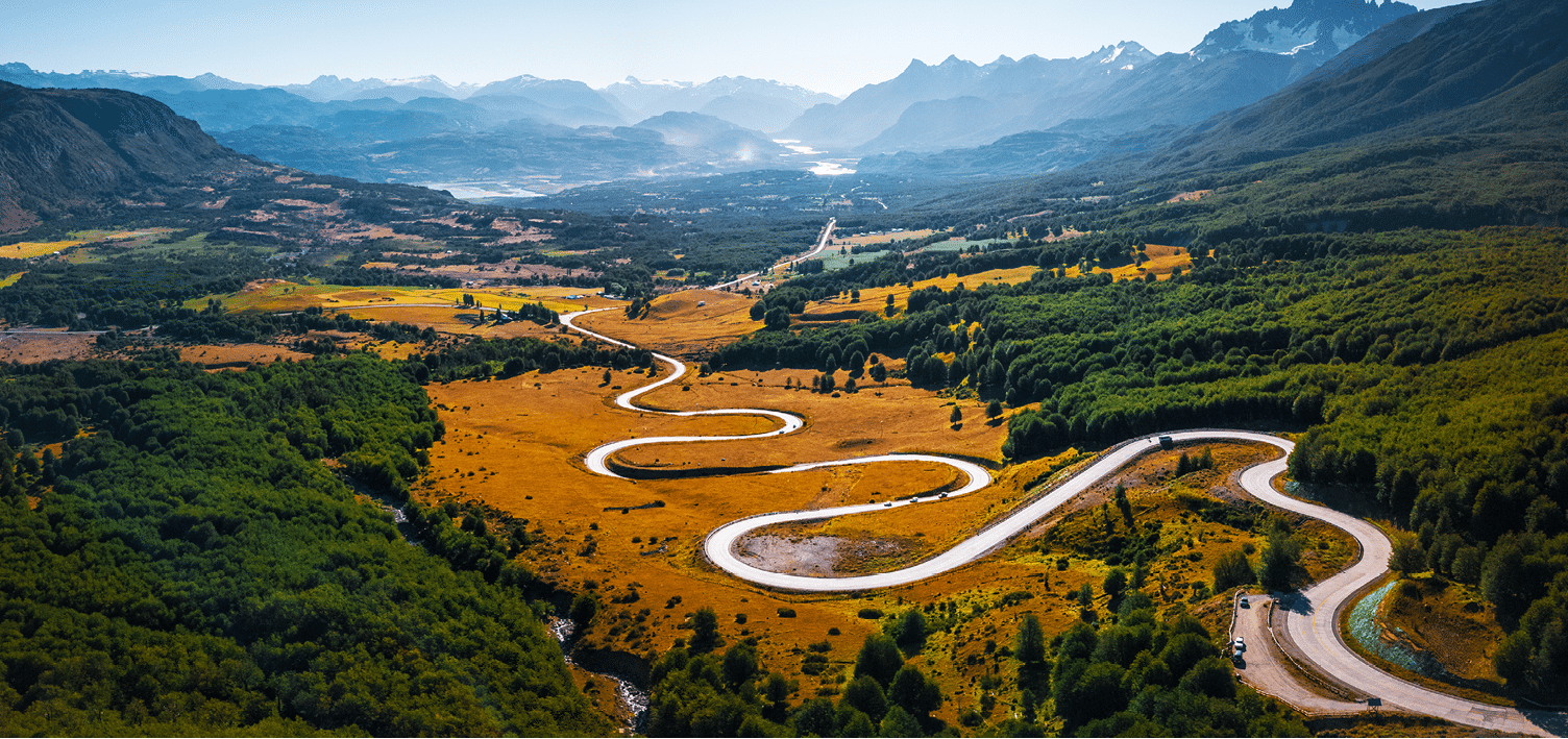 Curved asphalt road in the mountains. Adventure road Carretera Austral lies in the valley near the town of Cerro Castillo, Patagonia, Chile