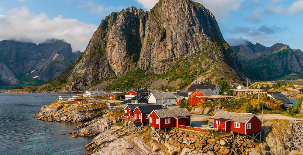 The view of the red cottages by the coastline in Hamn ¸y, Lofoten Islands, Norway