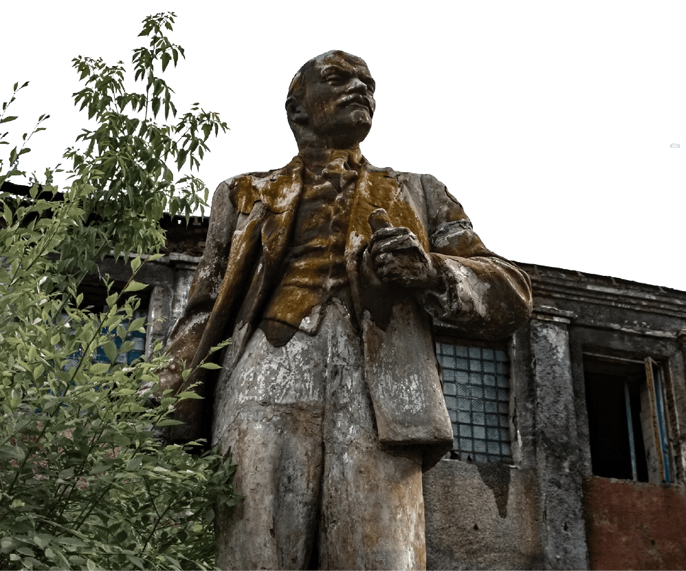 Lenin Monument on the background of an abandoned building in Novokuznetsk, Kemerovo region, Russia.
