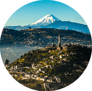 View of El Panecillo in the center of Quito with the Cotopaxi in the background