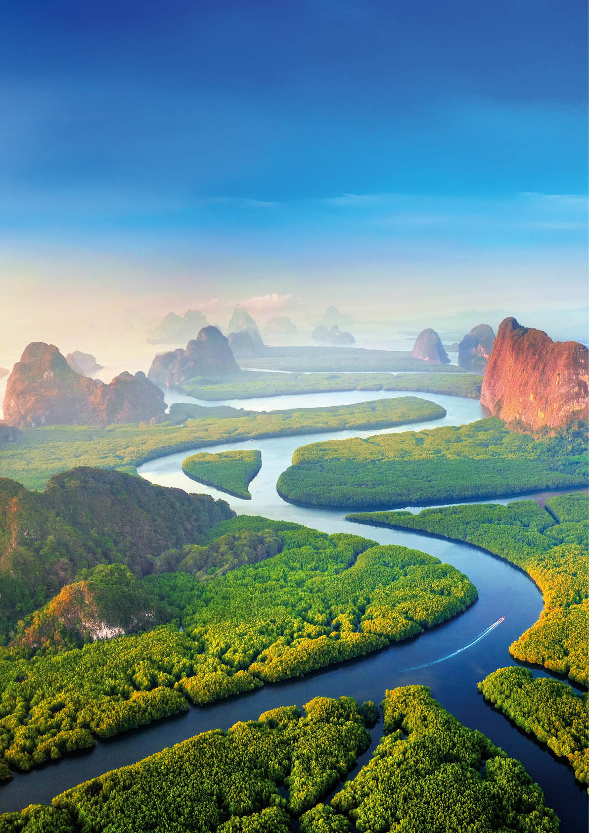 Aerial view of Phang Nga bay with mountains at sunrise in Thailand.