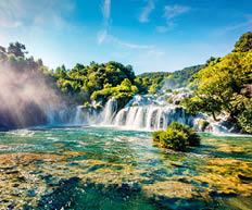 Perfect summer view of powerful Skradinski Buk waterfall. Spectacular morning scene of Krka National Park, Lozovac village location, Croatia, Europe. Beautiful world of Mediterranean countries.