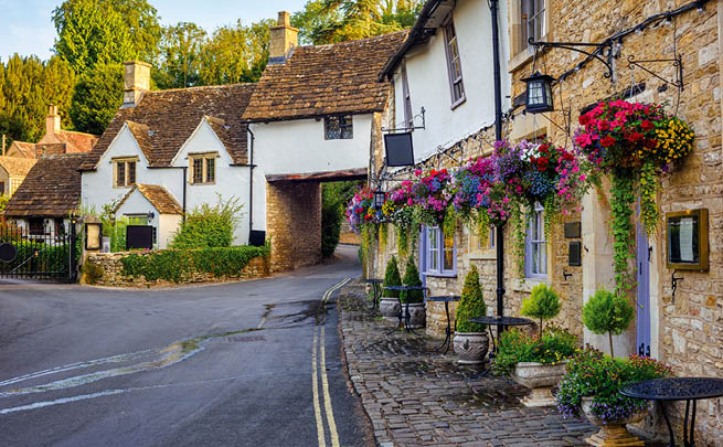 Traditional stone houses in Castle Combe village, one of the most visited picturesque villages in Cotswolds, England, United Kingdom