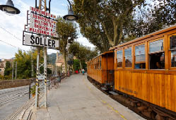 Soller, Spain - October 21, 2021: Ancient train Tren de Soller public transport transit transportation at Soller railway station on Mallorca in Spain.