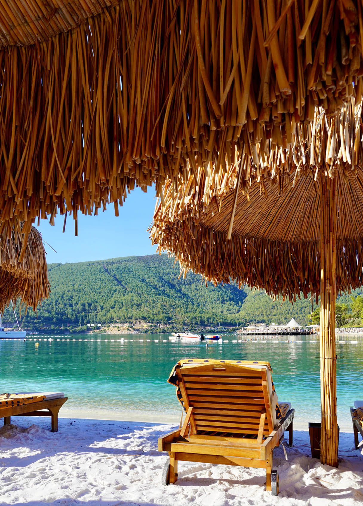 Bodrum, Turkey - August 2020: Hotel beach Lujo. Vacation in Paradise. Beautiful tropical beach banner. White sand travel tourism wide panorama background concept. Amazing beach landscape, yachts, Luxury tourism. High quality photo