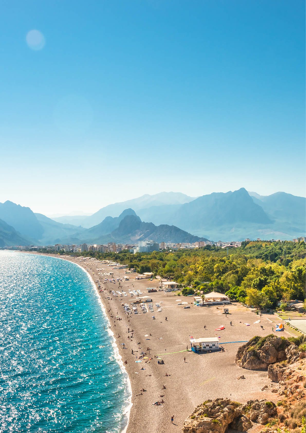 Panoramic bird view of Antalya and Mediterranean seacoast and beach with a paraglider, Antalya, Turkey, Autumn