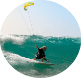 The kite surfer rides the waves of the Atlantic Ocean on the Fuerteventura island, Canary Islands