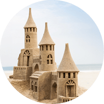 Grand sandcastle on the beach during a summer day