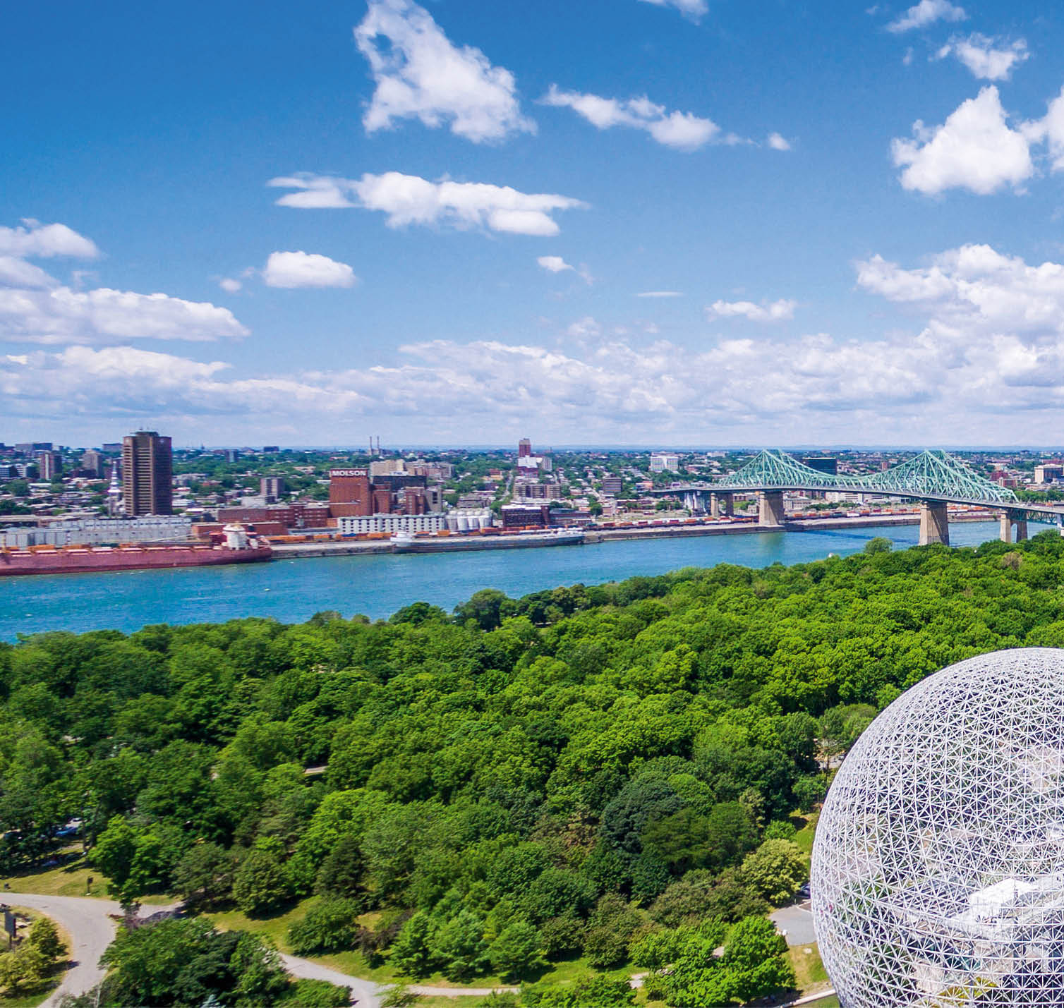 Montreal, Canada - July 3, 2016: Aerial view of Montreal cityscape including the Biosphere geodesic dome and Jacques Cartier bridge in Montreal, Quebec, Canada.