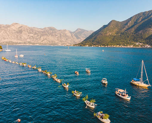 aerial view of fashinada holidays in perast montenegro. boats in one line