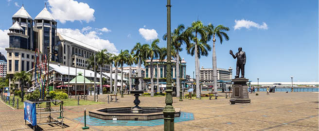 Port Louis waterfront promenade in Mauritius capital city on a sunny day