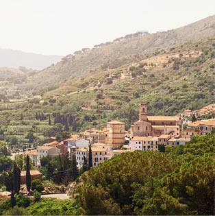 Capoliveri has unusual architecture, the town still retains its medieval appearance, with its narrow, picturesque vineyards and arcades known as chiassi. Island of Elba, Italy