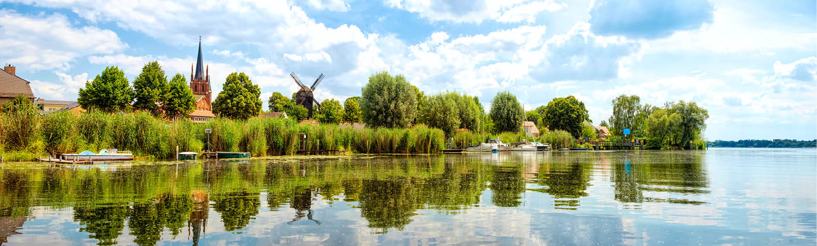 View to shore of Werder, Havel, with Holy Spirit Church -Heilig Geist Kirche- and Bock Windmill -Bockwindm hle- , Potsdam, Germany