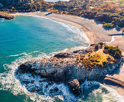 View from flying drone. Astonishing spring view of popular tourist destination - Acropoli di Bithia with Torre di Chia tower on background. Aerial morning view of Sardinia island, Italy, Europe. 