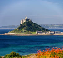 St Michael's Mount off the Cornish coast near Penzance. Cornwall in the United Kingdom. The island is joined to the mainland by a causeway passable only at low tide.