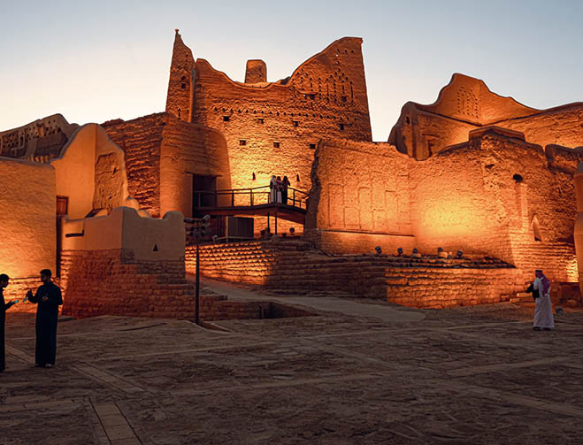 People standing outside the At-Turaif UNESCO World Heritage Site