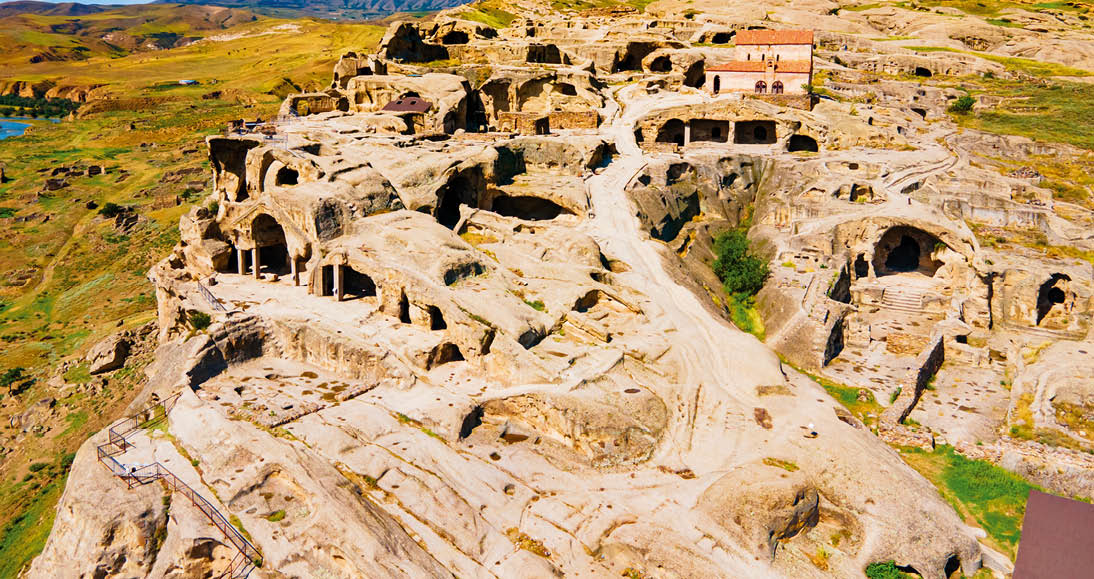 Uplistsikhe aerial panoramic view. Uplistsikhe is an ancient rock hewn town near Gori in Shida Kartli region of Georgia