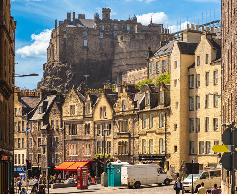 street scene of edinburgh with castle, scotland, uk