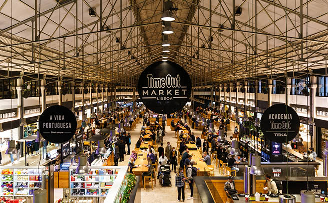Lisbon, Portugal - November 20 2021: Interior view of the Time Out Market Lisboa, a trendy food hall located in the Mercado da Ribeira at Cais do Sodr in Lisbon, Portugal.