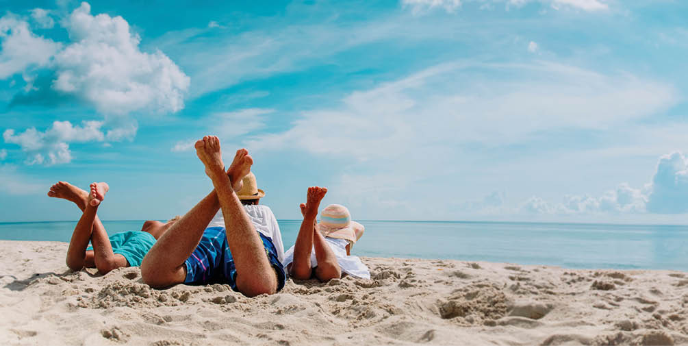 father with son and daughter relax on beach vacation, family at sea, panorama