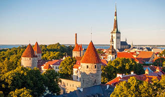 Cityscape of old town Tallinn with bright roofs in sunlight, Estonia