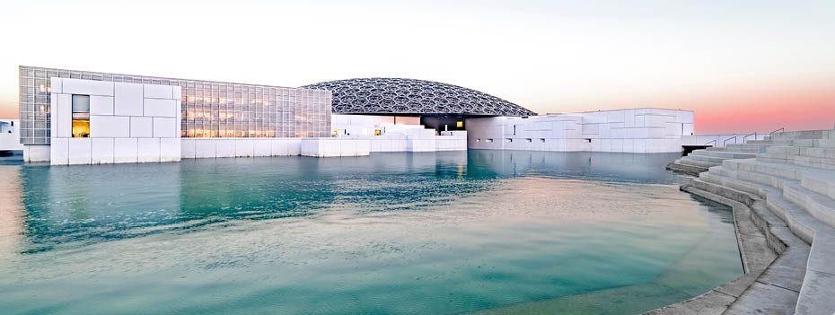Louvre, Abu Dhabi, United Arab Emirates - Dec.29, 2017: the famous museum of the French architect Jean Nouvel - panoramic view from the tribune at sunrise