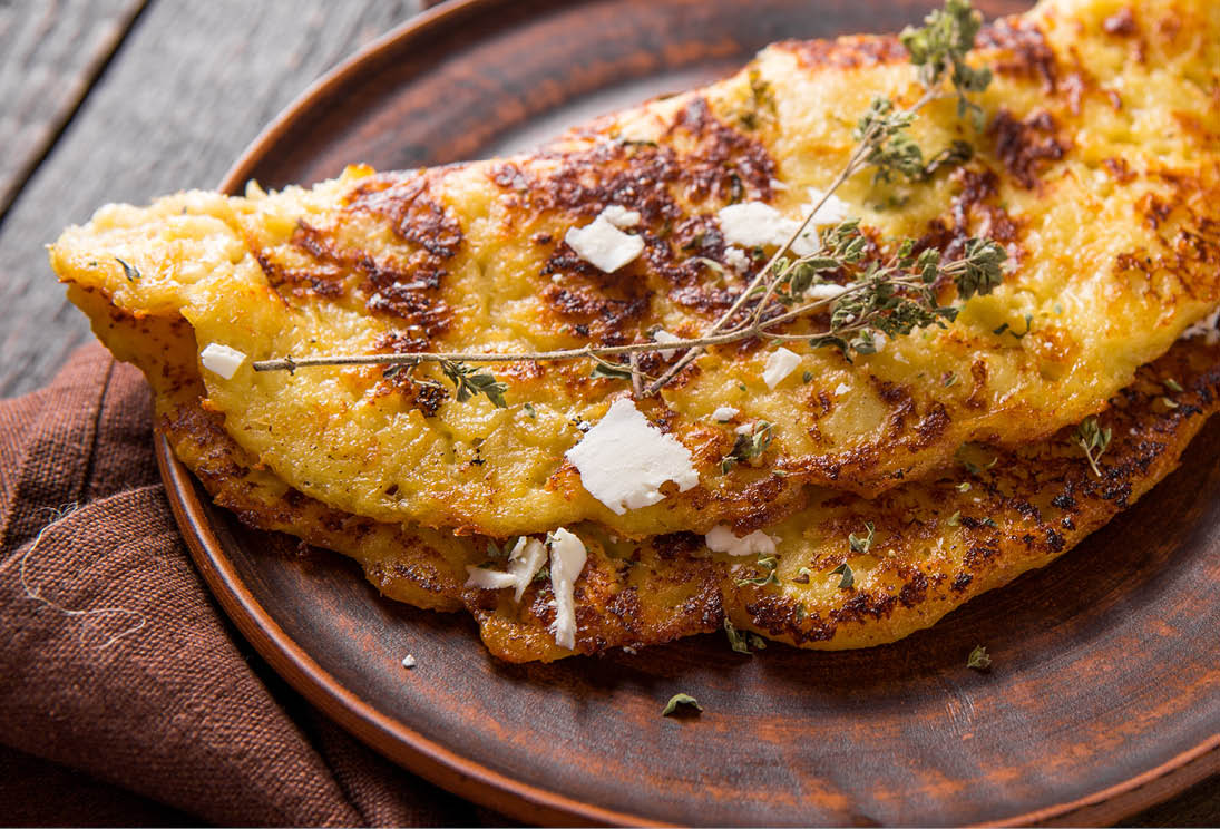 Irish Potato pancakes, latkes or boxty and sauces on wooden background