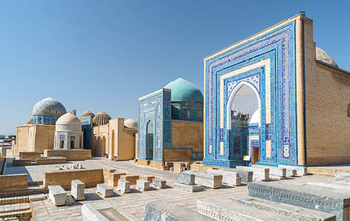 Awesome view of the Shah-i-Zinda Ensemble in Samarkand, Uzbekistan. Mausoleums decorated by blue tiles with designs. The necropolis is a popular tourist attraction of Central Asia.