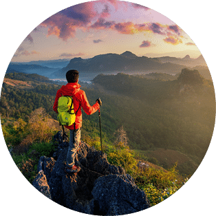 Backpacker standing on sunrise viewpoint at Ja Bo village, Mae hong son province, Thailand.