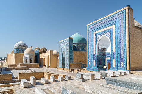 Awesome view of the Shah-i-Zinda Ensemble in Samarkand, Uzbekistan. Mausoleums decorated by blue tiles with designs. The necropolis is a popular tourist attraction of Central Asia.