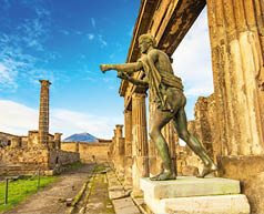 Ancient Pompeii city skyline and bronze Apollo statue, Italy travel photo