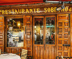 Madrid, Spain - July 10, 2024: Entrance door in Restaurant Sobrino y Botin, the oldest working restaurant in the city.