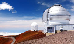 Observatories on top of Mauna Kea mountain peak. Astronomical research facilities and large telescope observatories located at the summit of Mauna Kea on the Big Island of Hawaii, United States
