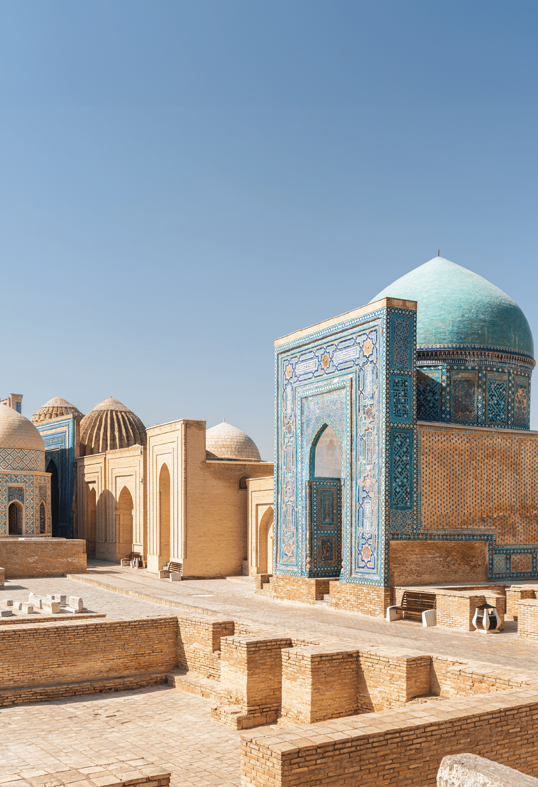 Awesome view of the Shah-i-Zinda Ensemble in Samarkand, Uzbekistan. Mausoleums decorated by blue tiles with designs. The necropolis is a popular tourist attraction of Central Asia.
